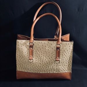 Tan ostrich-like accents on a brown leather purse